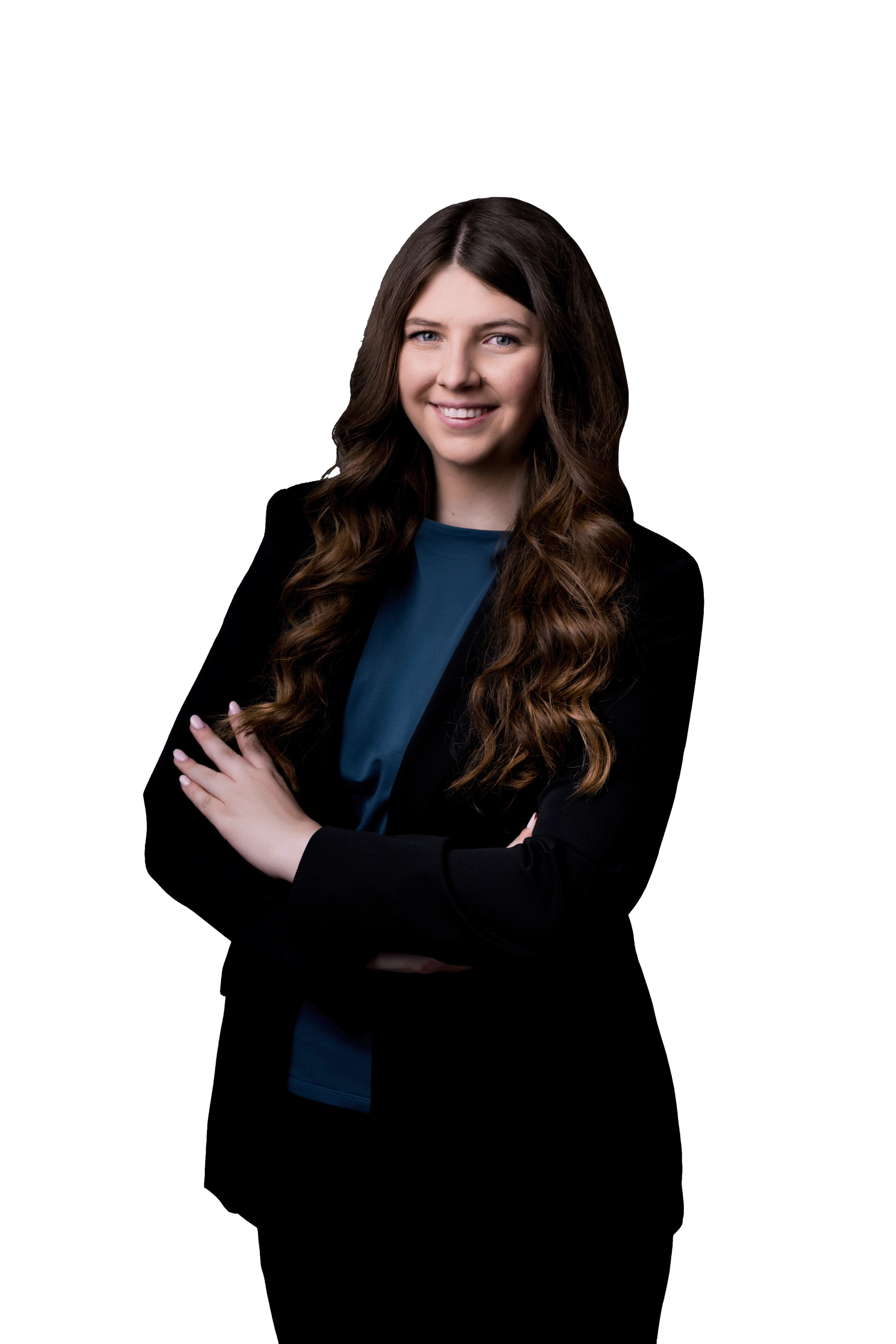 A dark haired woman wearing a black blazer smiles at the camera